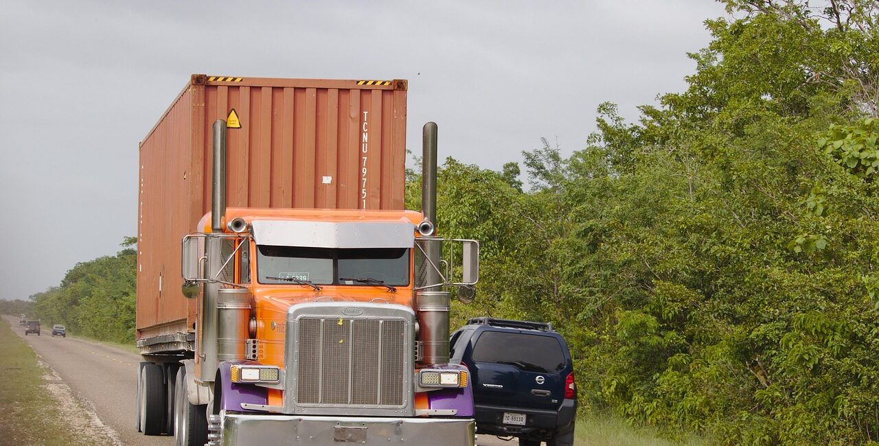 Semi truck passing SUV on two-lane road