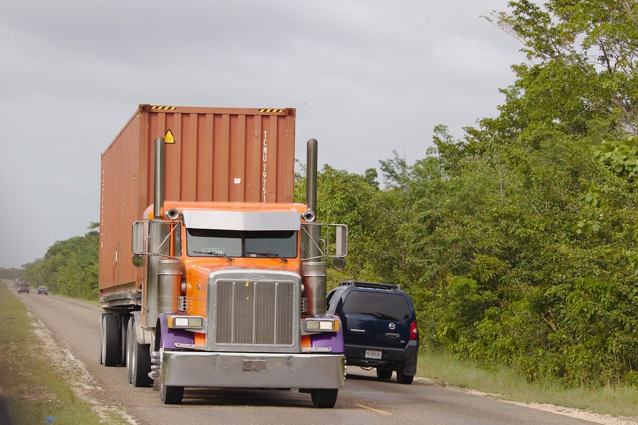 Semi truck passing SUV on two-lane road