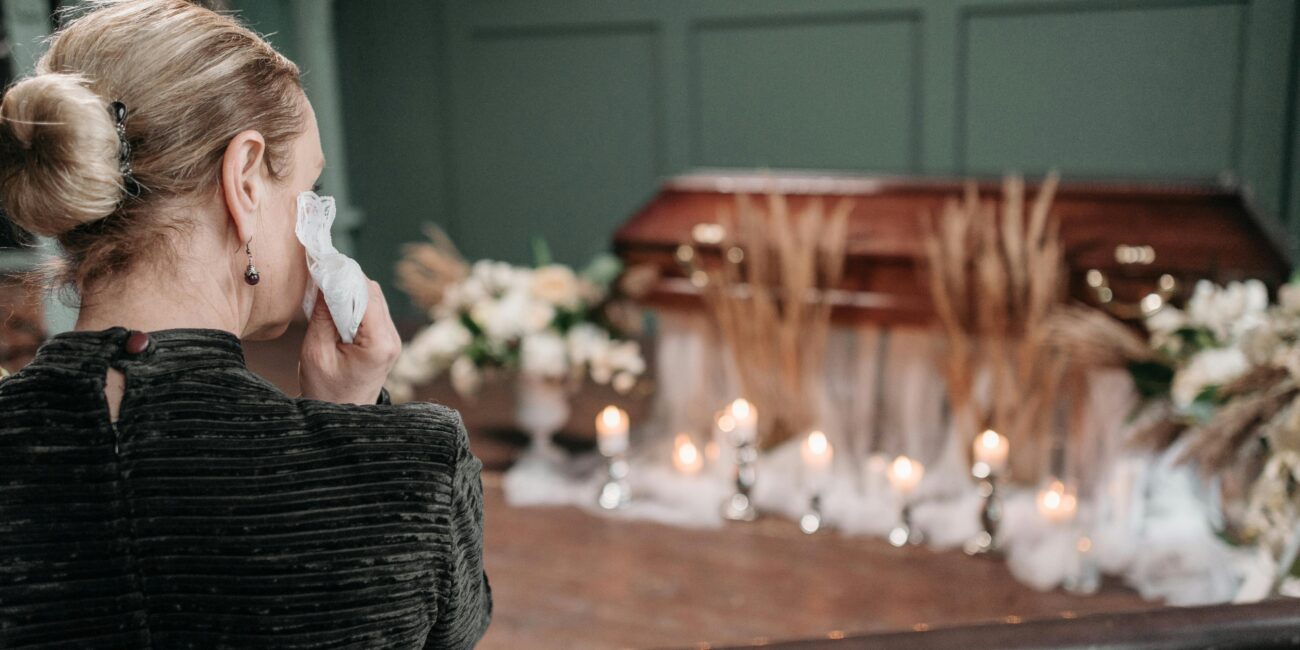 woman crying at a funeral
