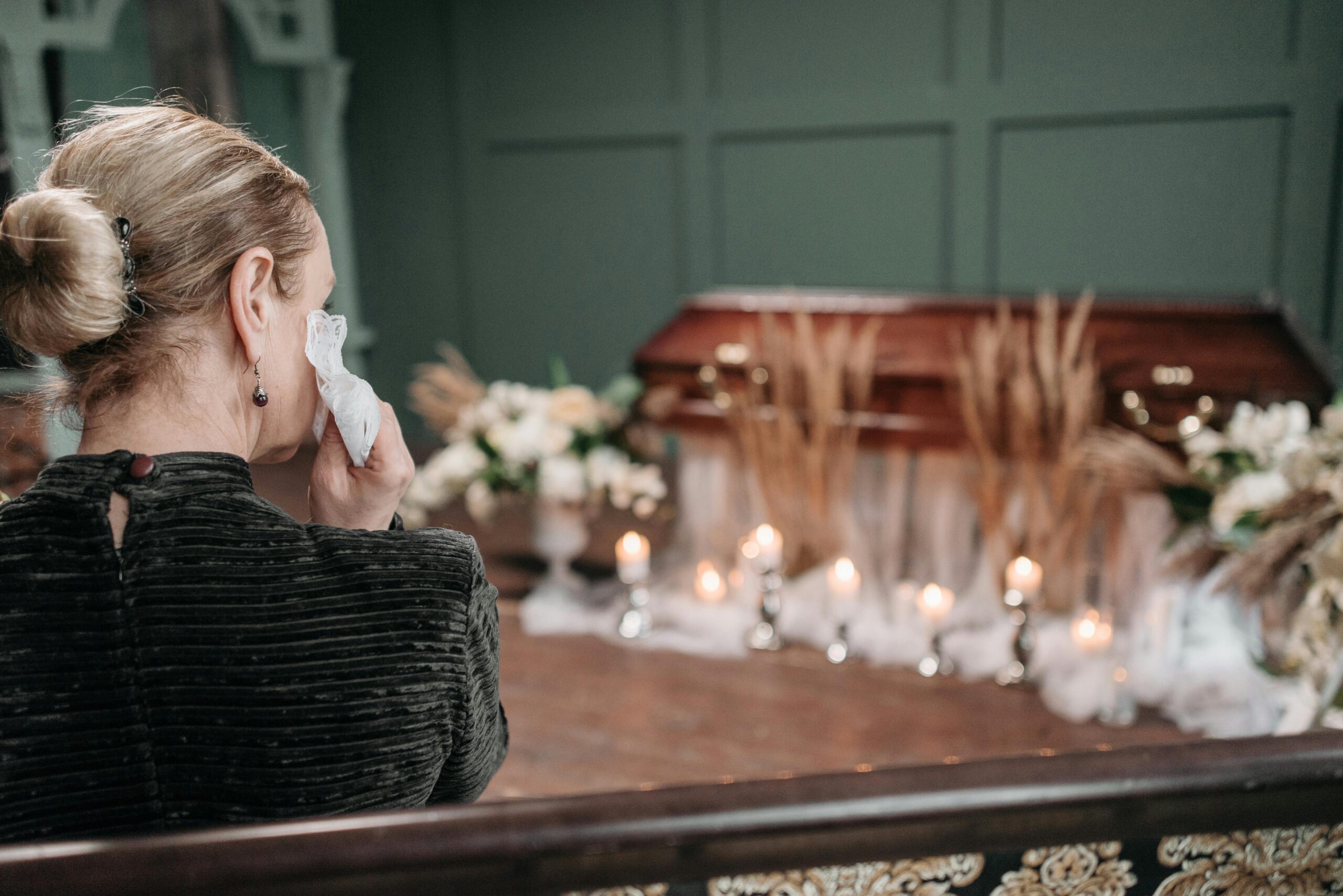 woman crying at a funeral