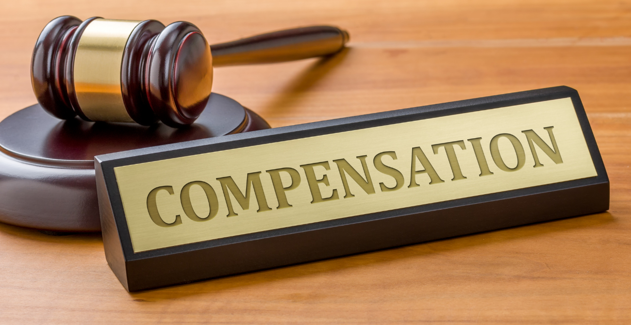 gavel beside the word compensation